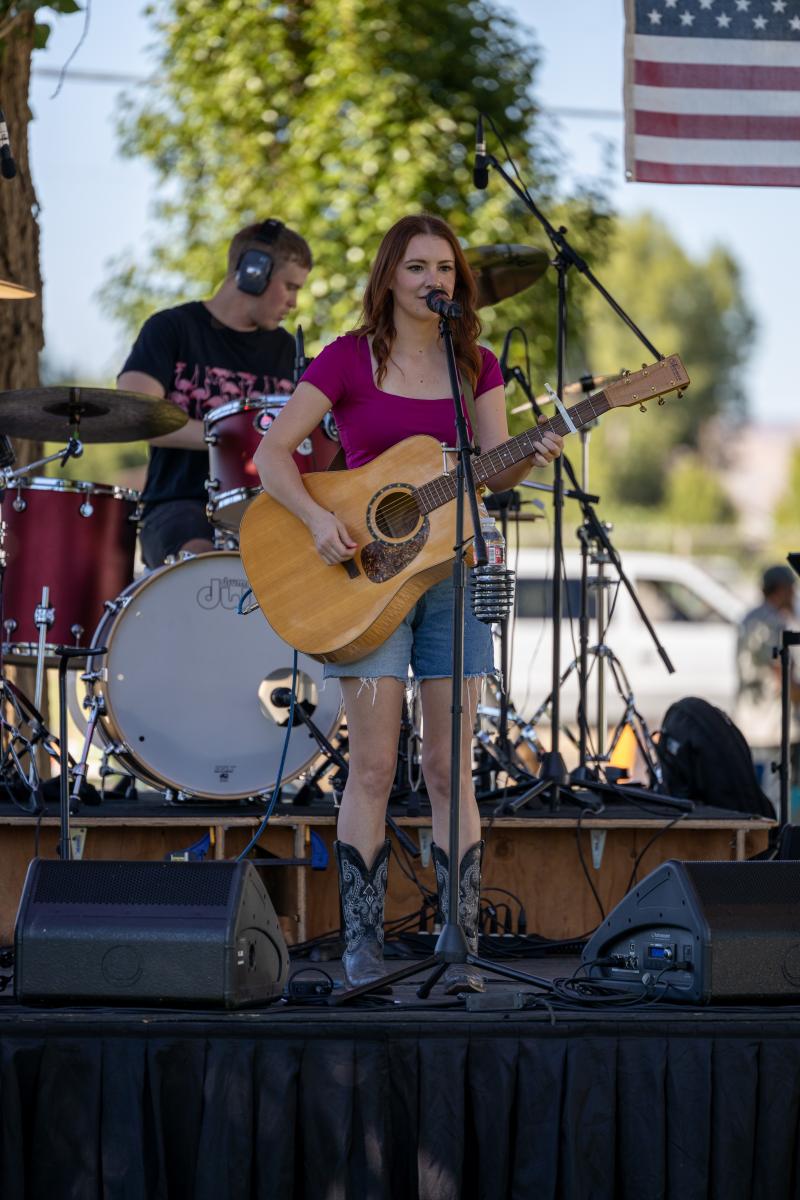 Maddie Wilson Concert. Maddie playing the guitar