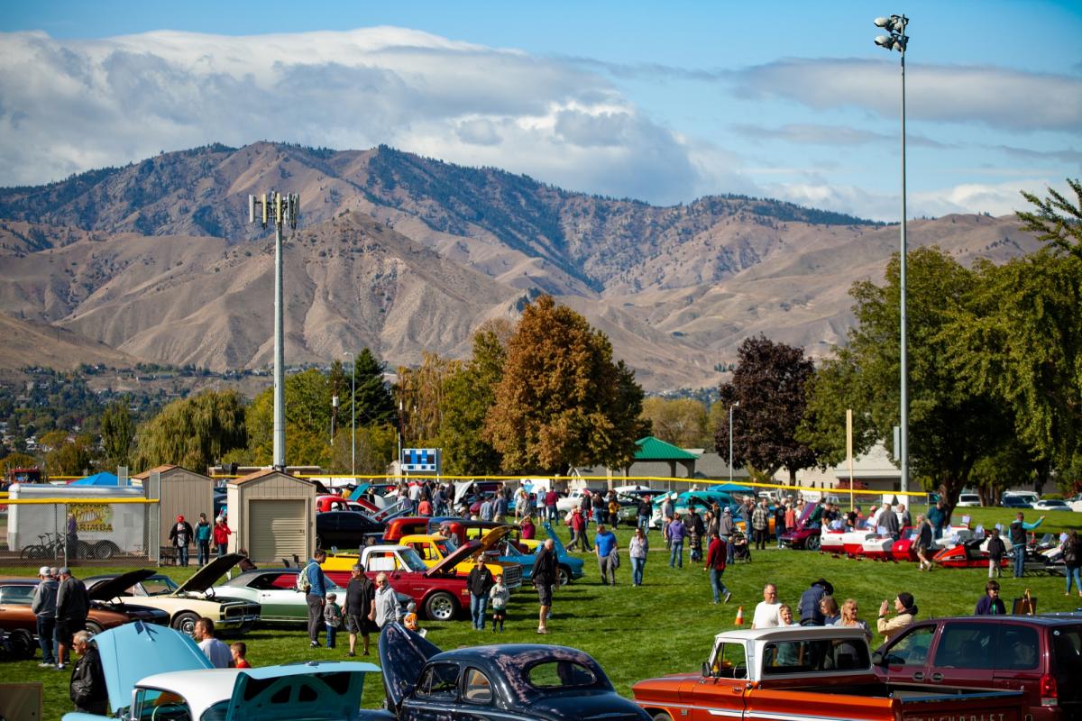 Arial view of vintage cars lining a baseball field.