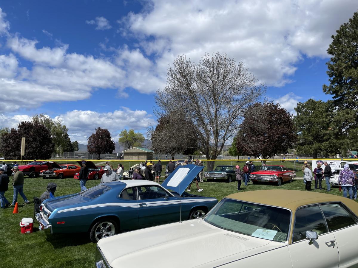 Arial view of vintage cars lining a baseball field.