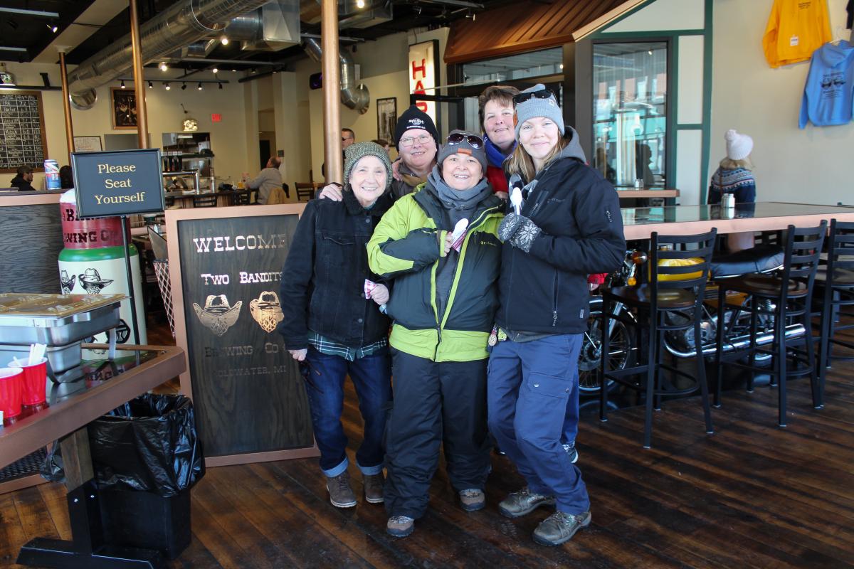 A group of tasters pause for a photo at Two Bandits Brewing Co.