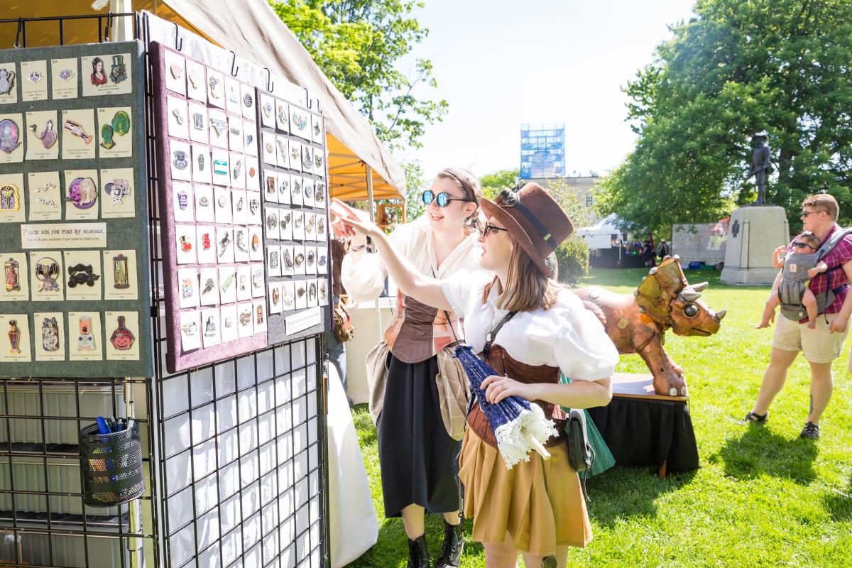 Customers looking at a vendor's wares, by Leah C-S Photography