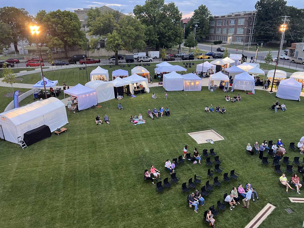 overhead view of artist tents and festival goers