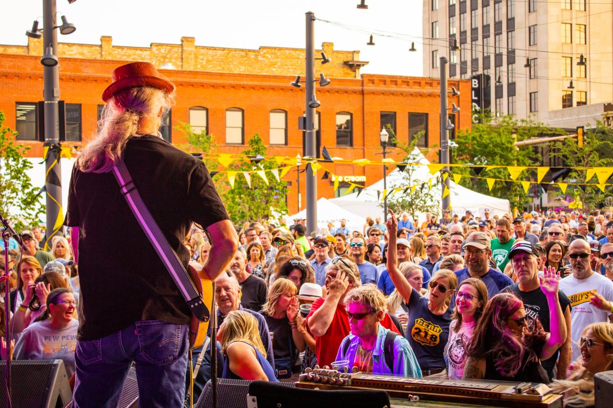 Looking out into the crowd of people watching a performance, at Fargo Broadway Square.