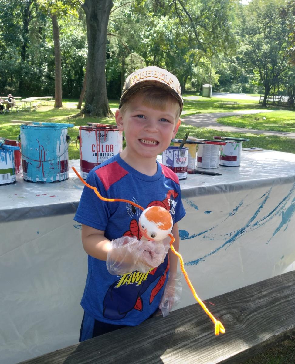 Happy boy finishing his creation