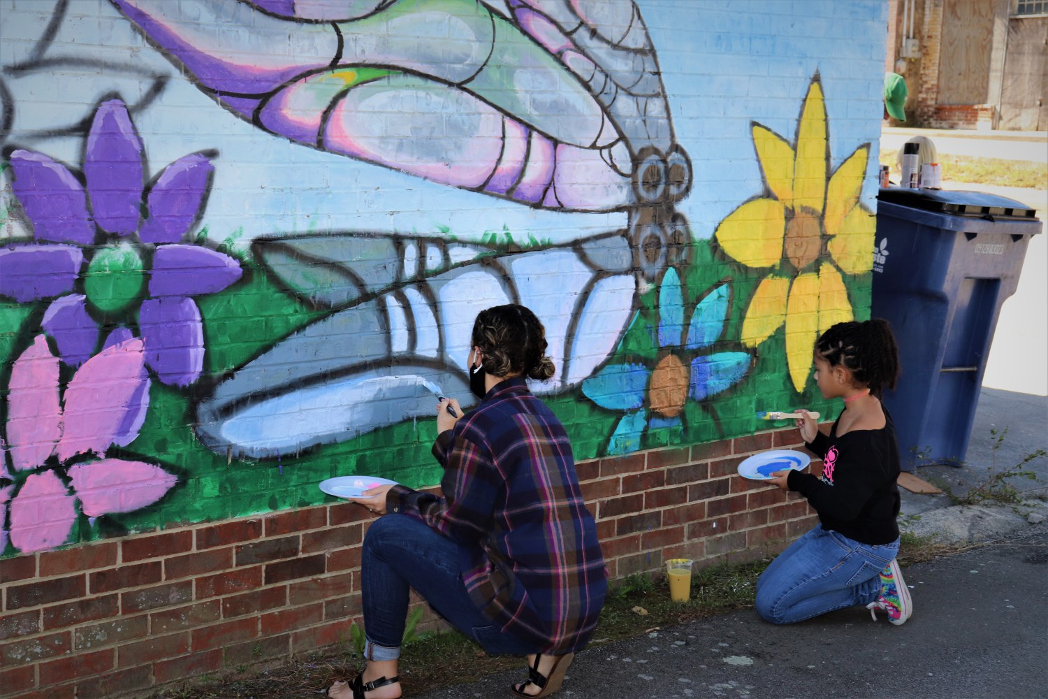 Kids painting Murals in Town at Market on Main