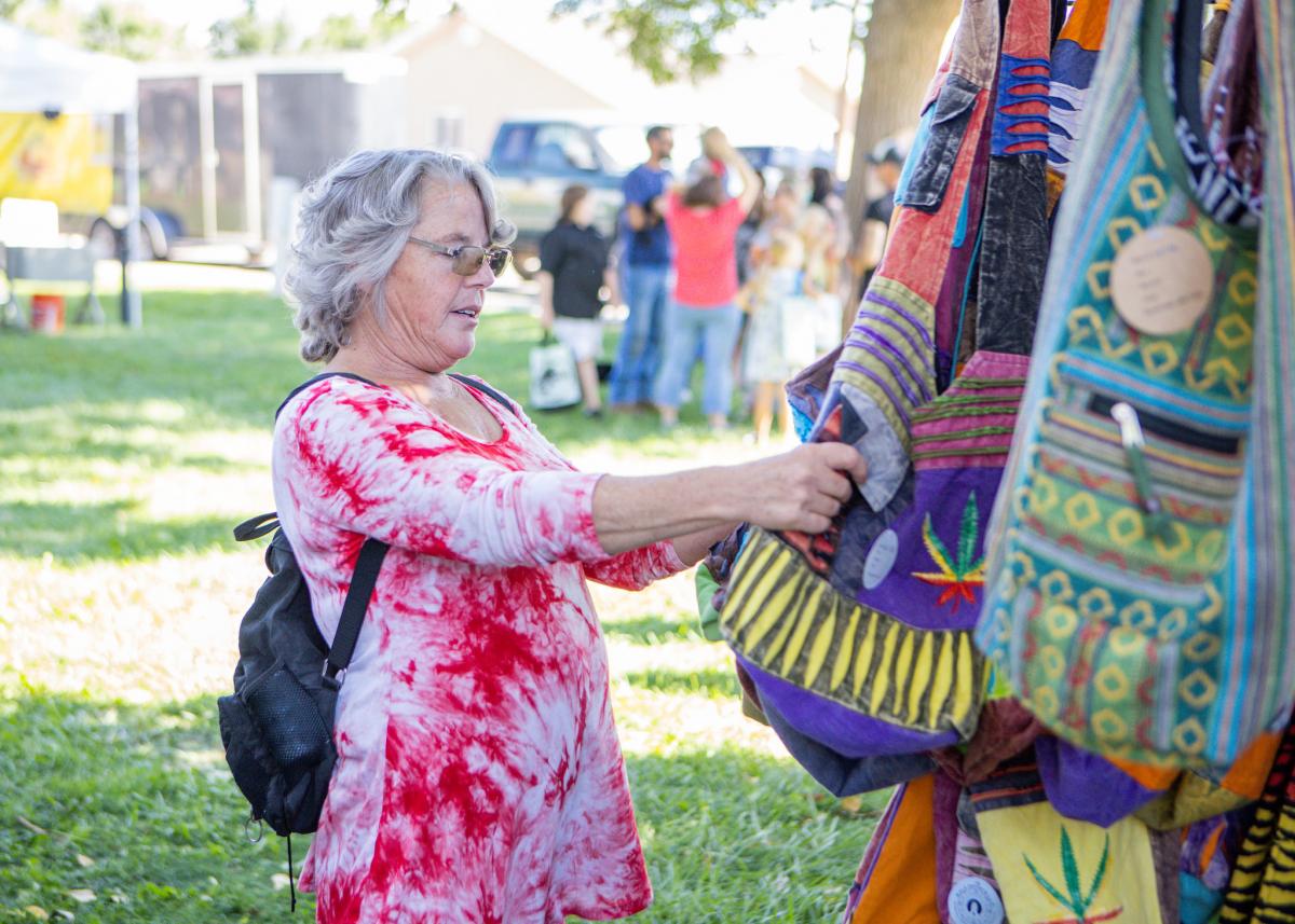 Woman examines vendor products