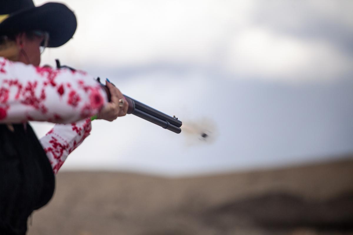 Woman shooting a gun