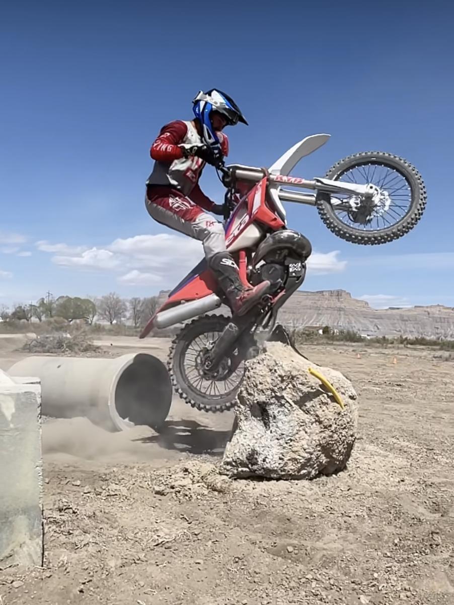 Dirt Bike jumping big cement block