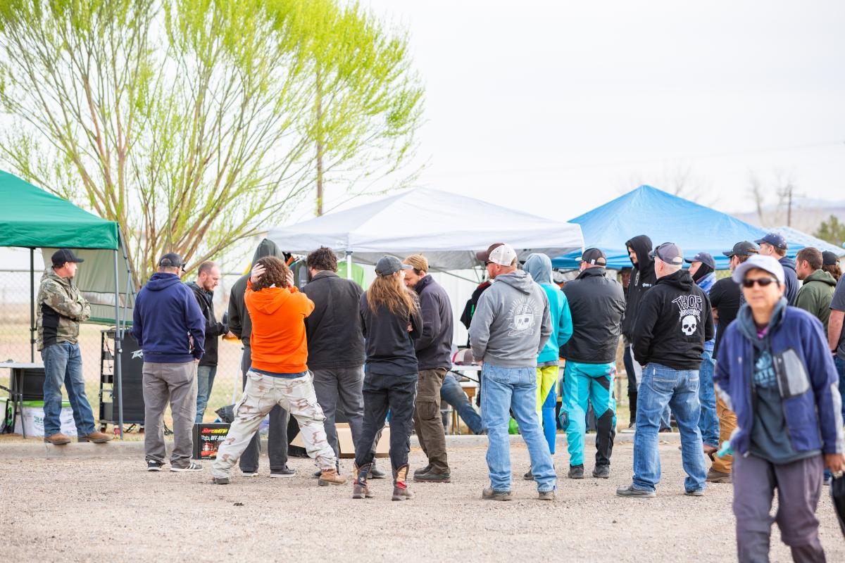 group of participants in front of Vendor tent