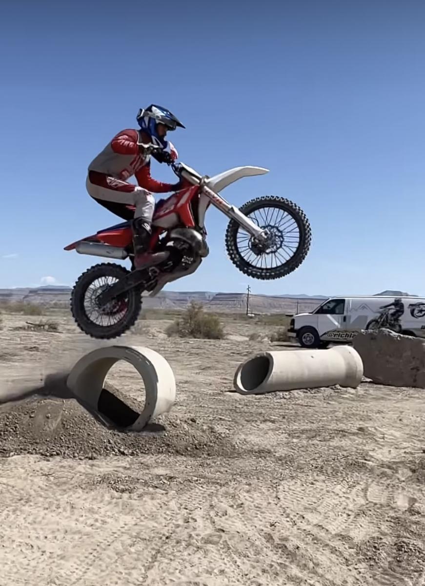 Dirt Bike jumping big cement block