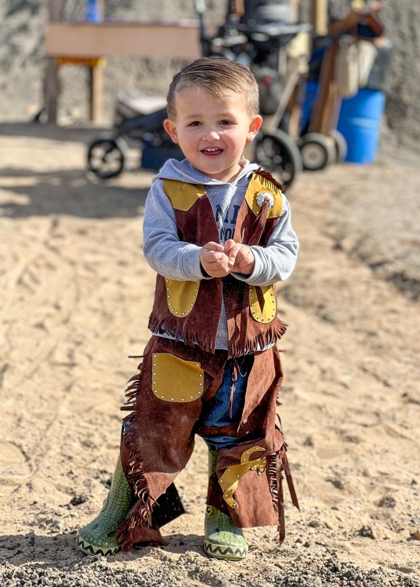 little boy in old west clothes