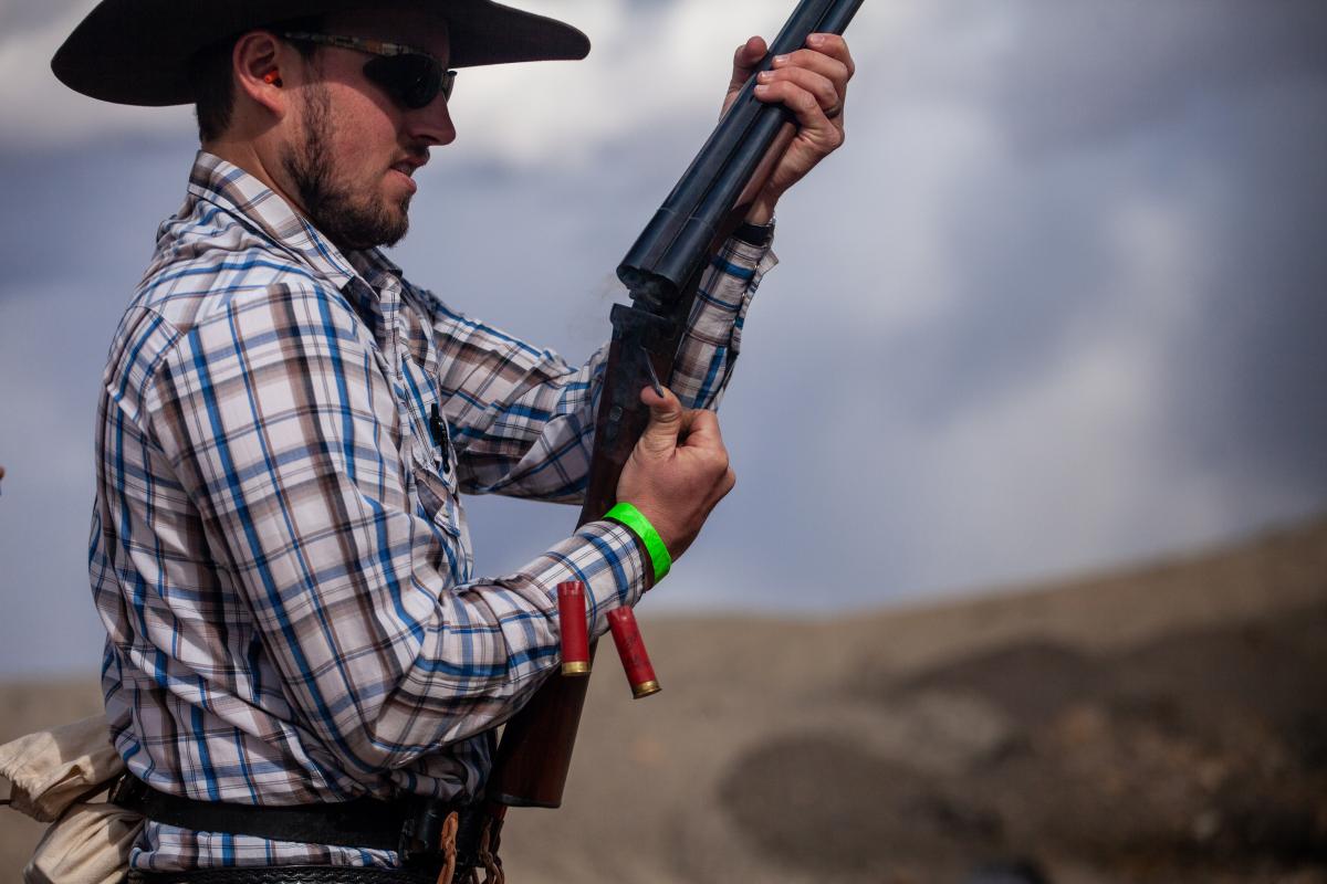 man unloading a shot gun