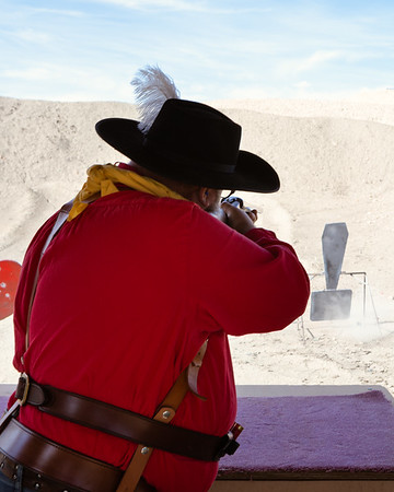 man shooting a gun