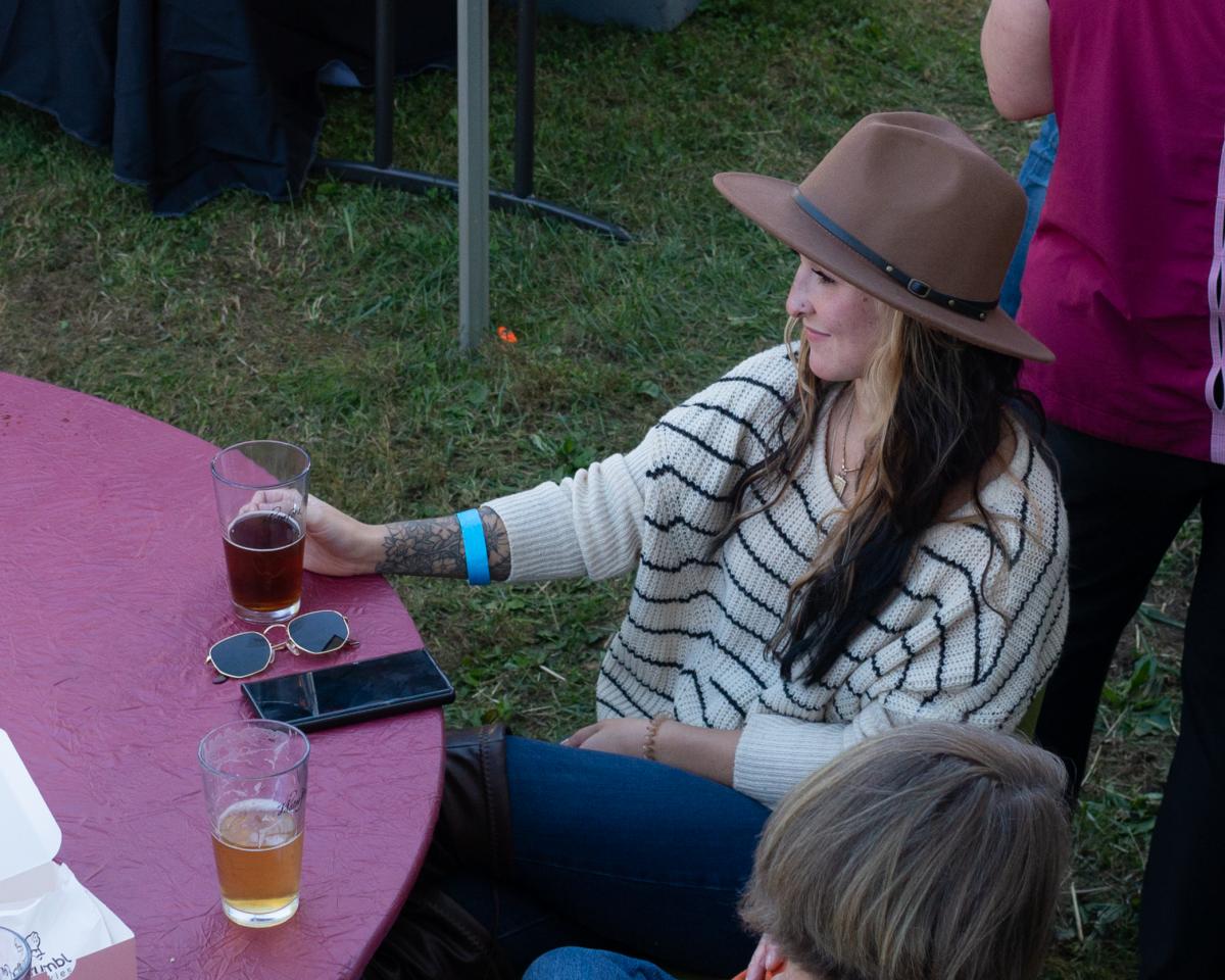 Fairgoer enjoying the Wine & Beer garden  (2021; Jennifer Jules Studios)