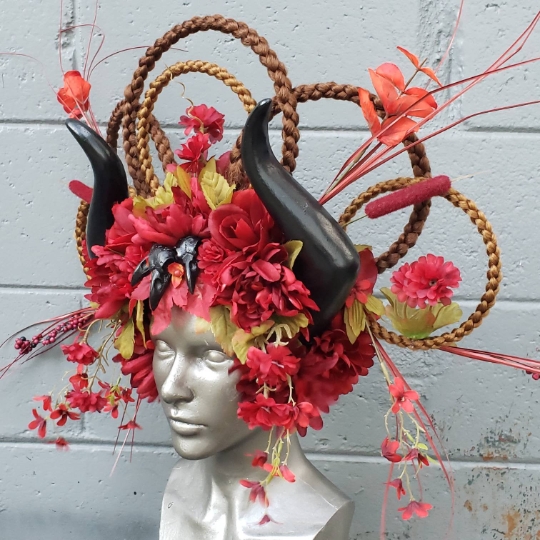 Fantasy red and black floral headdress with horns and bird skulls picture