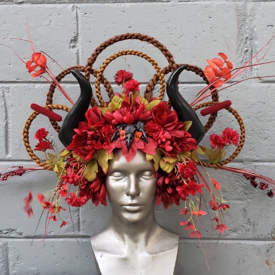 Fantasy red and black floral headdress with horns and bird skulls picture