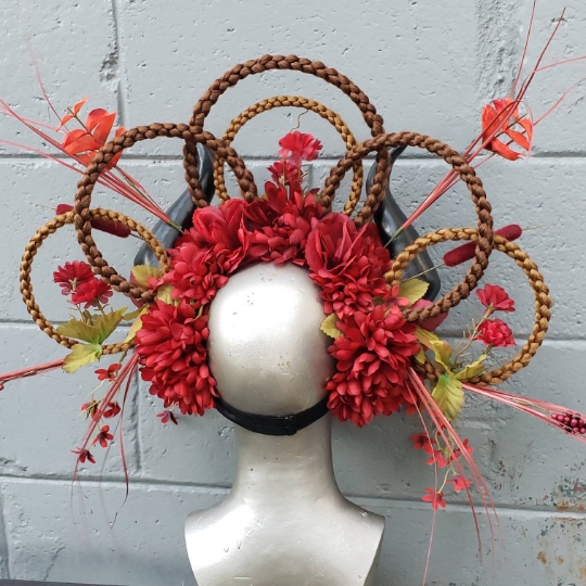 Fantasy red and black floral headdress with horns and bird skulls picture