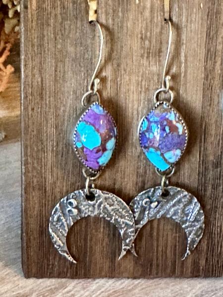 Long Mohave turquoise and silver earrings with hanging coral textured moons. Purple and turquoise silver drop earrings. Coral moon earrings.