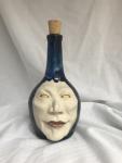 Ceramic face bottle