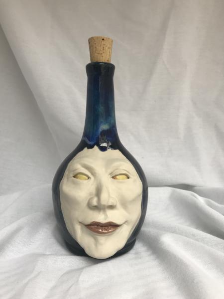 Ceramic face bottle