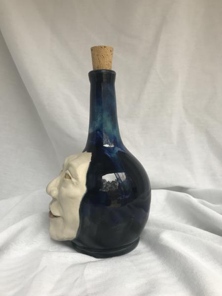 Ceramic face bottle picture